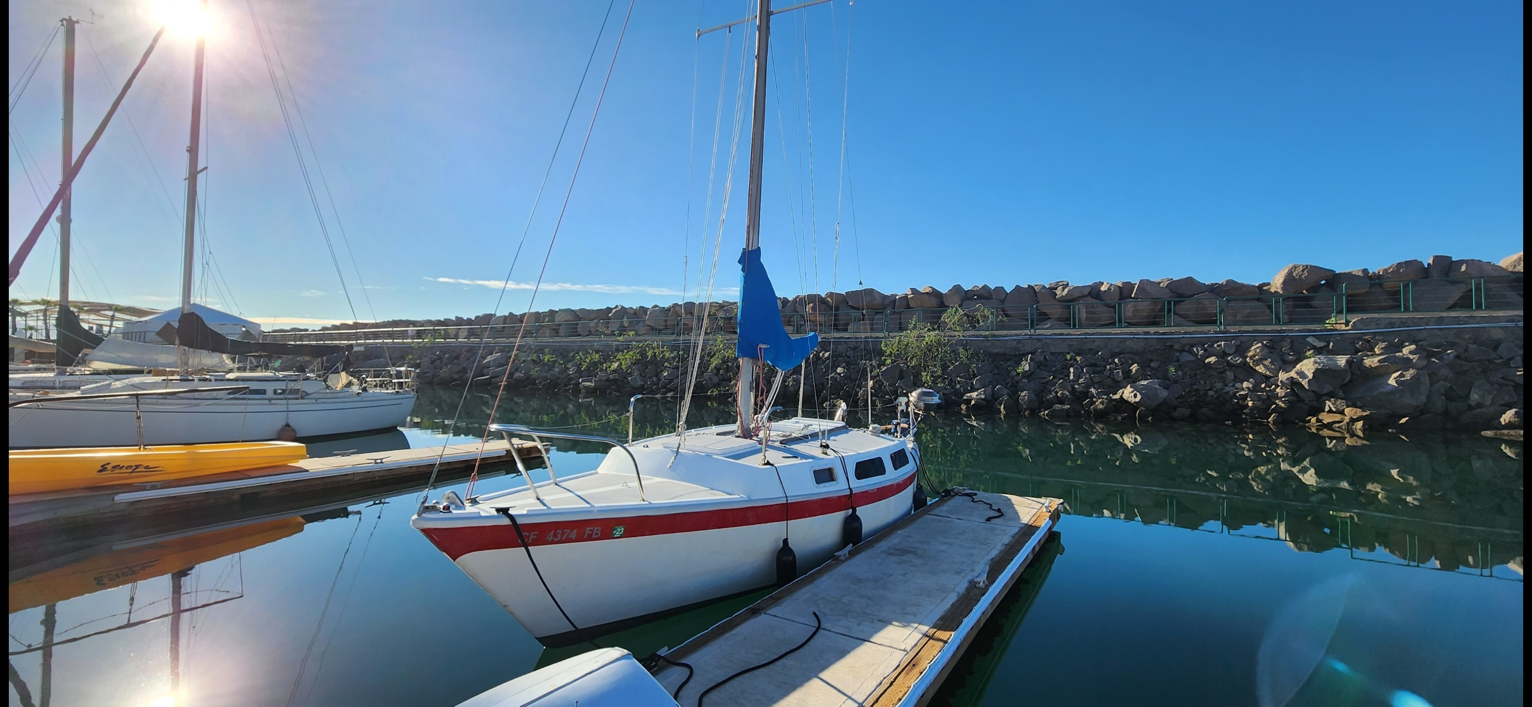 The Cal T/4 sailboat in her marina slip at sunrise